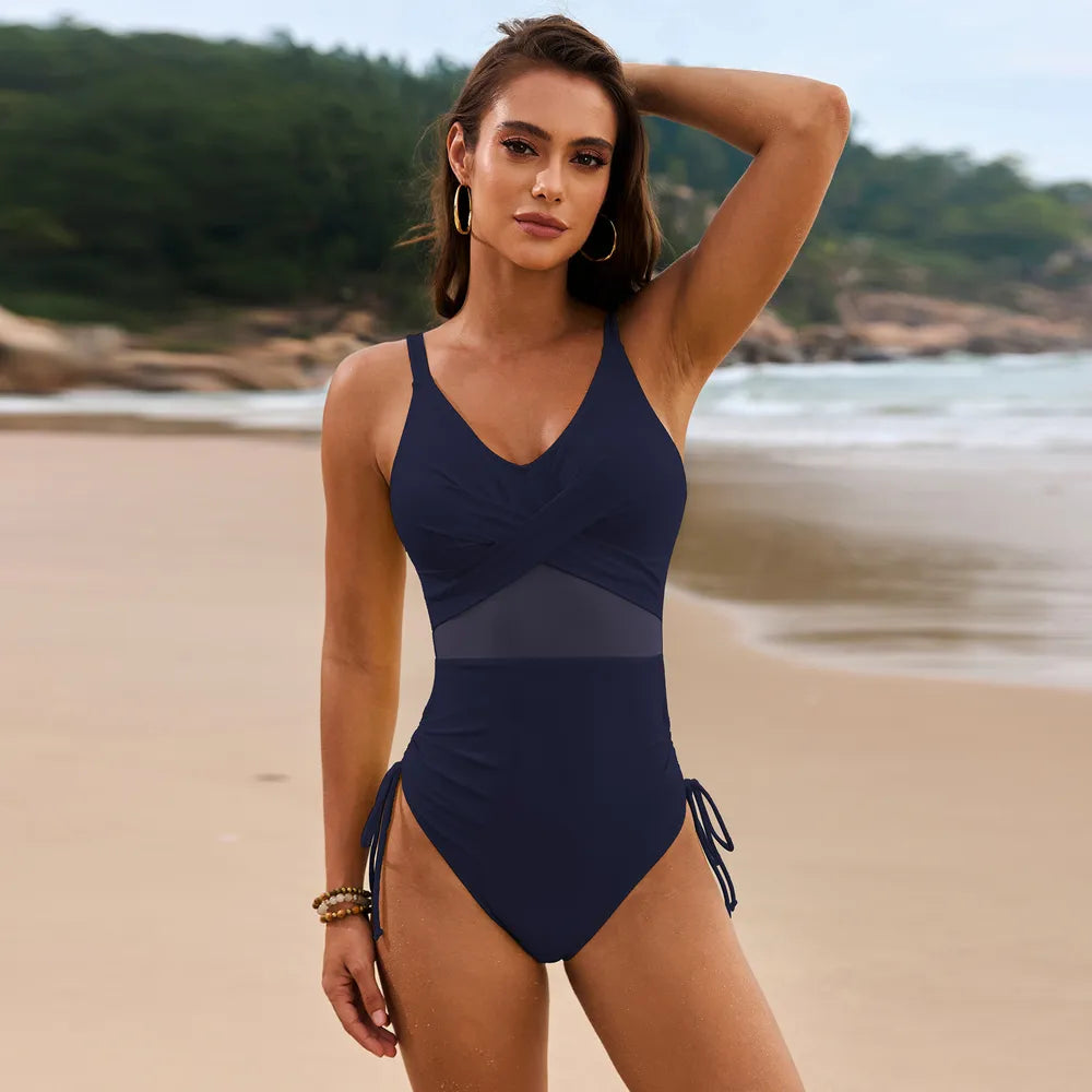 Salt Kisses The Drift One-Piece swimsuit in dark navy with sheer mesh waist panel and drawstring hip ties
